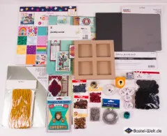 Detailausschnitt mit Shimelle-Musterpapierpad, Greeting-Card-Kit und vierfachem Holz-Schattenkasten.